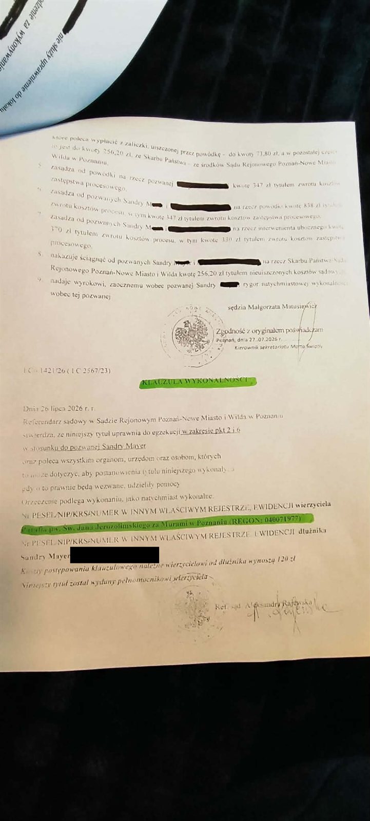 Fragment tytułu wykonawczego z klauzulą wykonalności z 26 lipca 2026 roku, z zaznaczoną nazwą wierzyciela — parafii wraz z numerem REGON