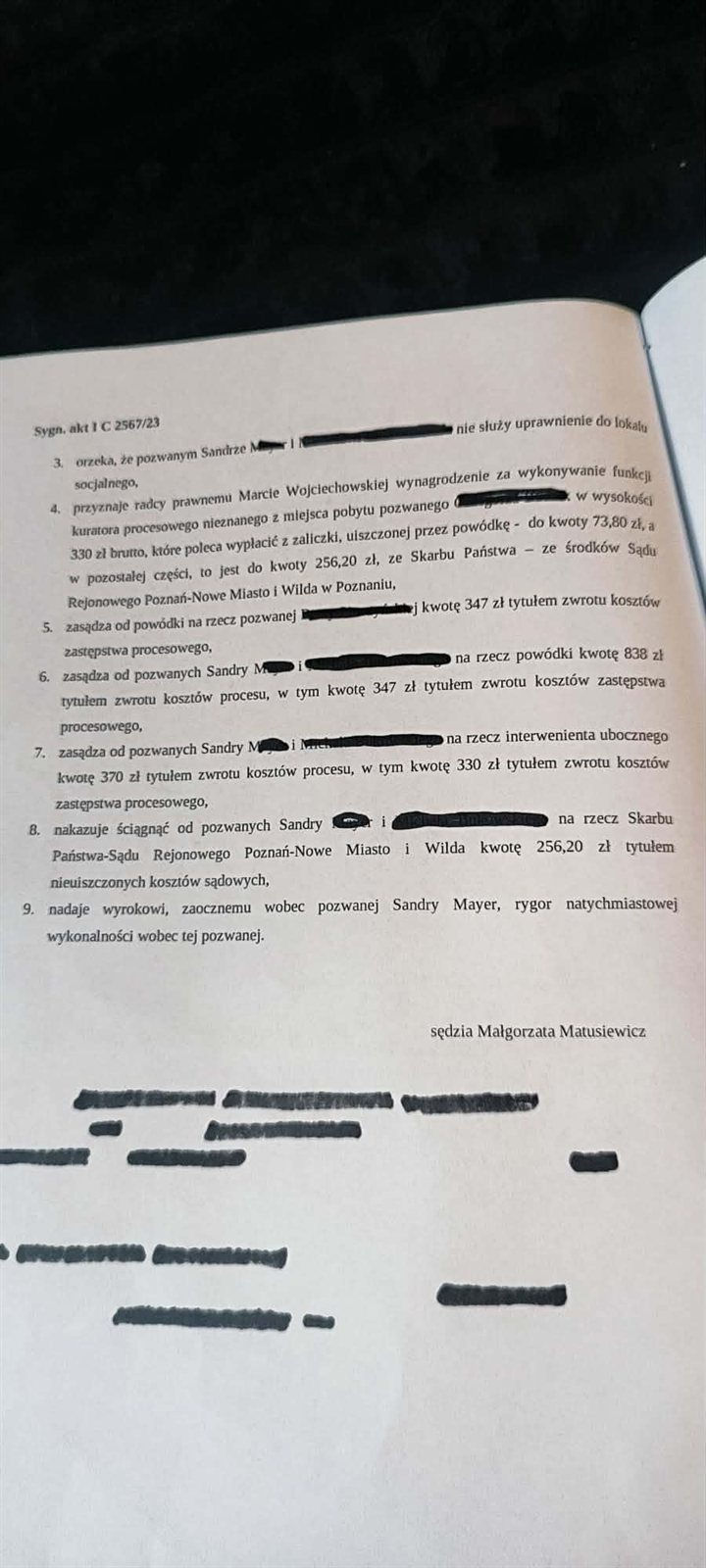 Druga strona wyroku z punktami od 3 do 9, w tym rozstrzygnięciem o braku uprawnienia do lokalu socjalnego i rygorze natychmiastowej wykonalności